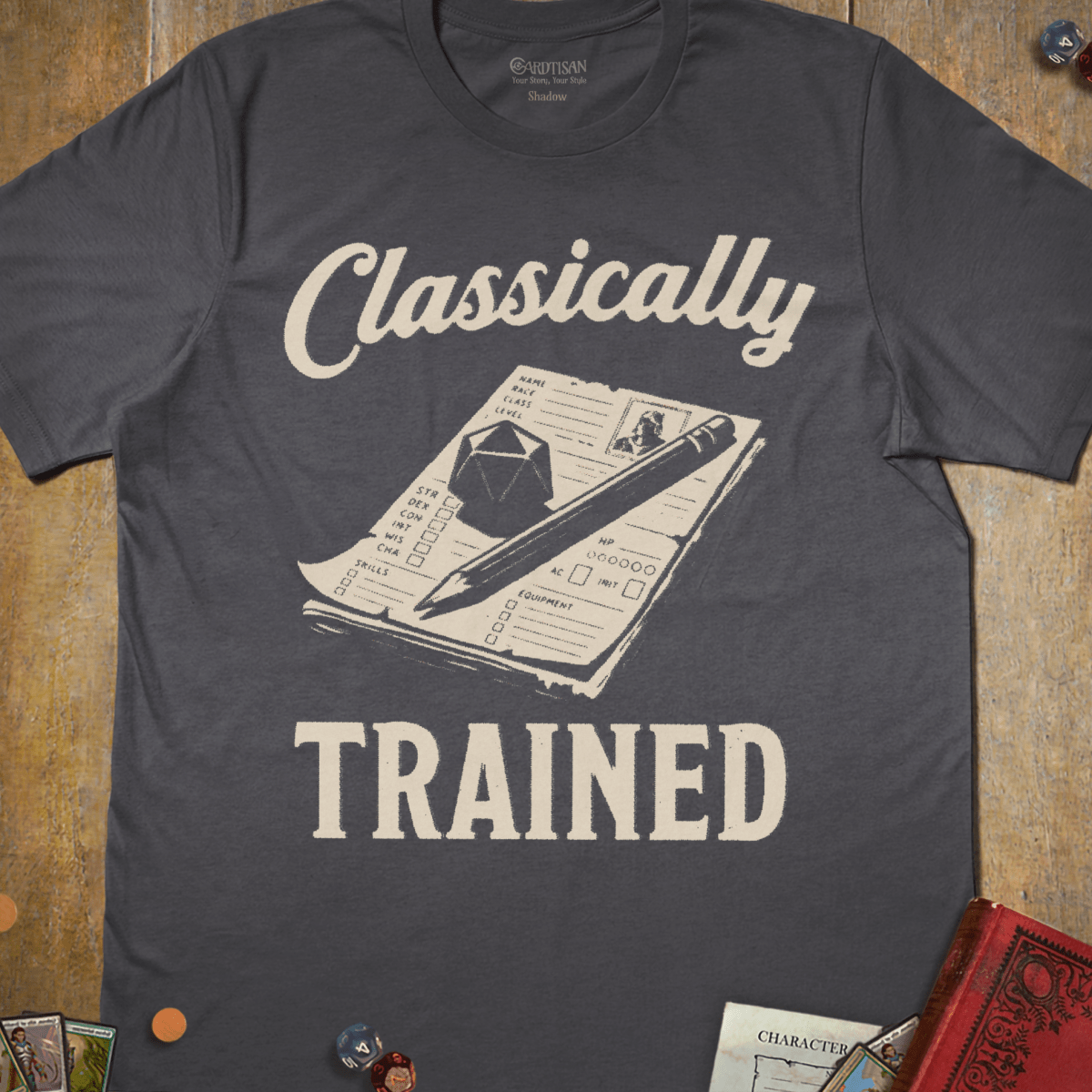 Charcoal gray tabletop RPG T-shirt with a quill and parchment and classically trained text