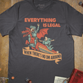 Charcoal graphic T-shirt with a knight riding a red dragon down a rainbow illustration and 