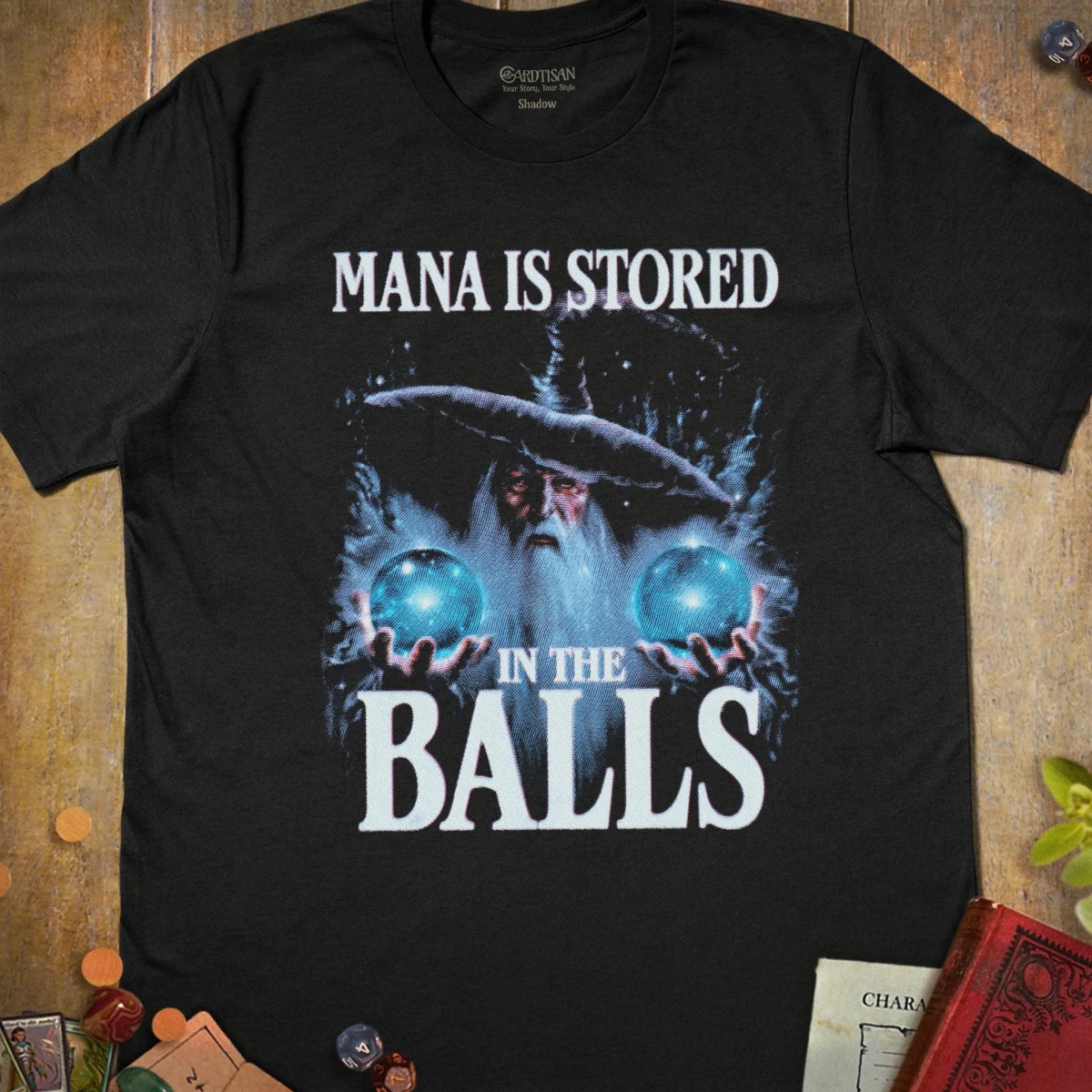 Black fantasy T-shirt with a wizard holding two glowing blue orbs and Mana Is Stored in the Balls text