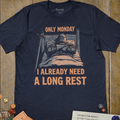 Navy graphic T-shirt with a knight tucked into bed in full armor illustration and 