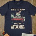 Navy trading card game T-shirt with a frog wizard at a card table and This Is Who You're Attacking text