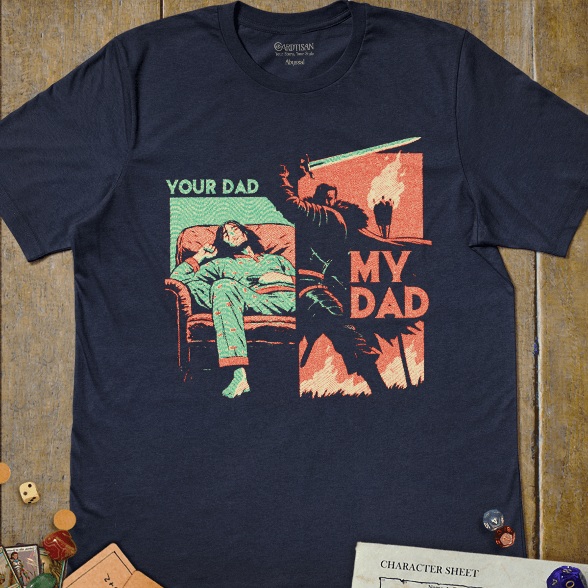 Navy graphic T-shirt with a split panel illustration of a sleepy dad in a recliner beside an armored dad in battle and "Your Dad, My Dad" text